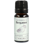 Bergamot essential oil bottle with Nikura label on a white background by White Cove UK