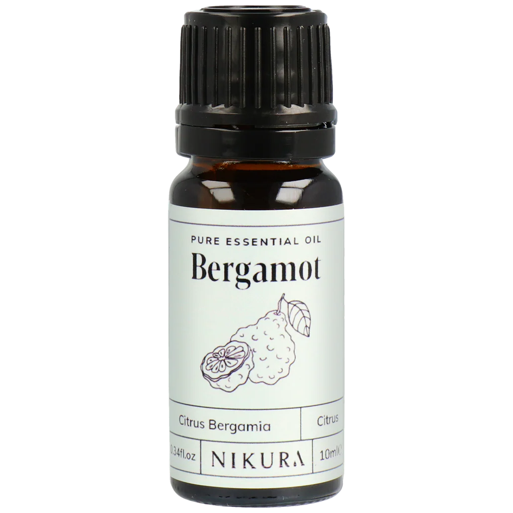 Bergamot essential oil bottle with Nikura label on a white background by White Cove UK