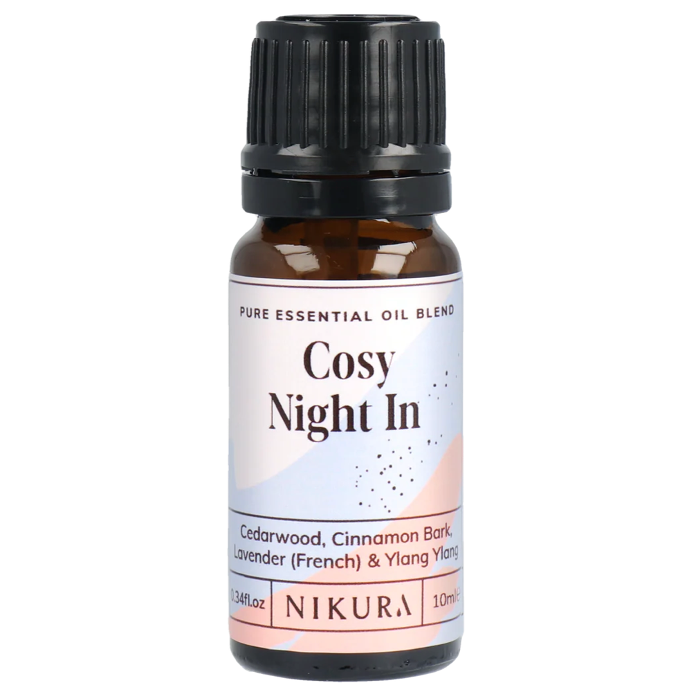 Essential oil bottle labeled 'Cosy Night In' by Nikura on a white background by White Cove UK