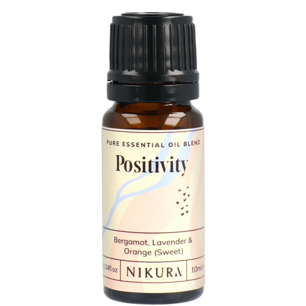 Nikura Positivity essential oil bottle on a white background by White Cove UK