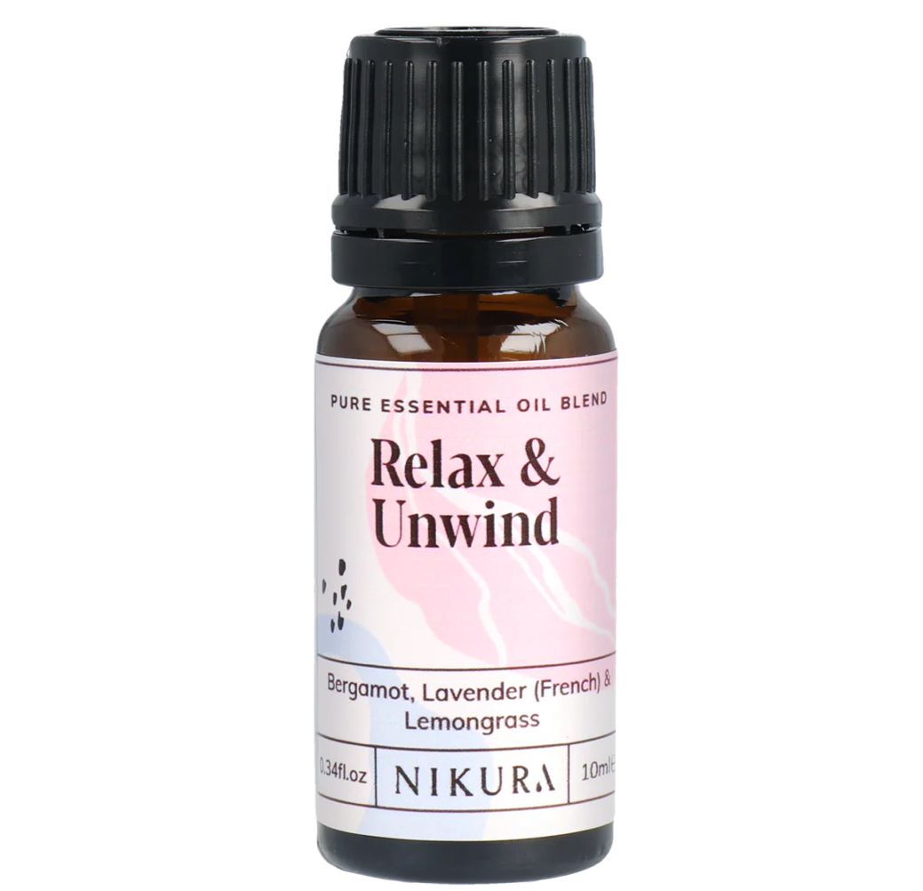 Essential oil bottle labeled 'Relax & Unwind' by Nikura on a white background by White Cove UK