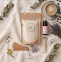 The complete Slow Down sustainable candle kit by White Cove UK featuring refillable plant-based candle sand. This tranquil morning flat lay showcases the full ritual ecosystem with Relax & Unwind fragrance oil, wooden wicks, and artisan ceramics, beautifully arranged for a mindful living aesthetic