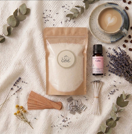 The complete Slow Down sustainable candle kit by White Cove UK featuring refillable plant-based candle sand. This tranquil morning flat lay showcases the full ritual ecosystem with Relax & Unwind fragrance oil, wooden wicks, and artisan ceramics, beautifully arranged for a mindful living aesthetic