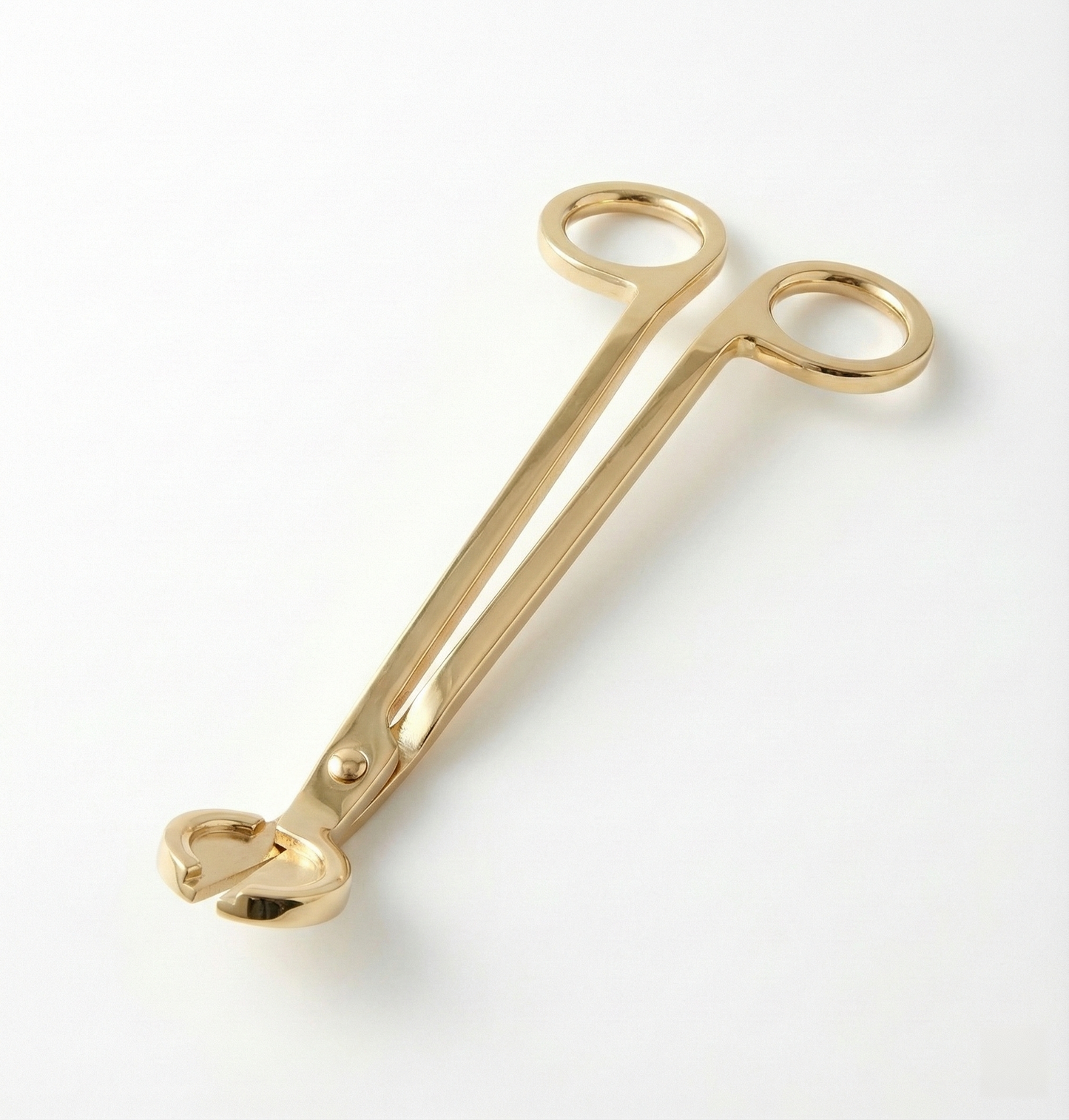 A premium gold wick cutter by White Cove UK. The luxury metal candle accessory is displayed on a clean, minimal background for sustainable home candle sand tools