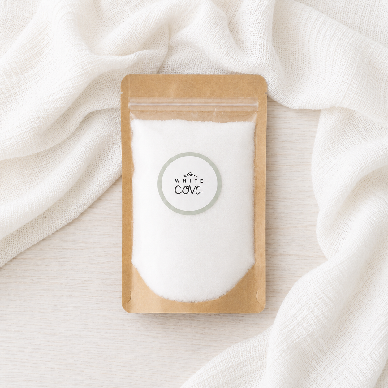 White Cove candle sand refill pouch styled on soft white linen, paraffin-free pearled wax for reusable candles