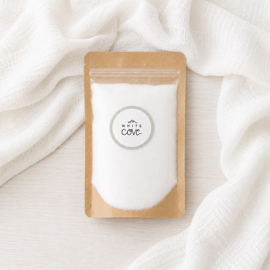 White Cove candle sand refill pouch styled on soft white linen, paraffin-free pearled wax for reusable candles