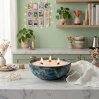 Aesthetic modern kitchen decor featuring White Cove UK plant-based candle sand. This lifestyle shot demonstrates how to reuse beautiful ceramic vessels to create a custom multi-wick candle, styled on a marble countertop alongside fresh botanicals and cozy, personalized room accessories