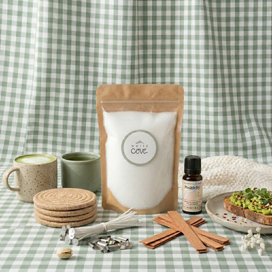 Sustainable morning wellness routine featuring White Cove UK's refillable candle kit. This lifestyle shot showcases the complete plant-based candle sand ecosystem, including dual wick options and Positivity fragrance oil, arranged next to a healthy breakfast aesthetic