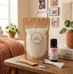 The Slow Down sustainable candle making kit by White Cove UK styled in a cozy living room. This lifestyle shot showcases the complete refillable candle ecosystem, including dual wick options and Calm fragrance oil, beautifully arranged alongside home decor to promote a relaxing, mindful aesthetic