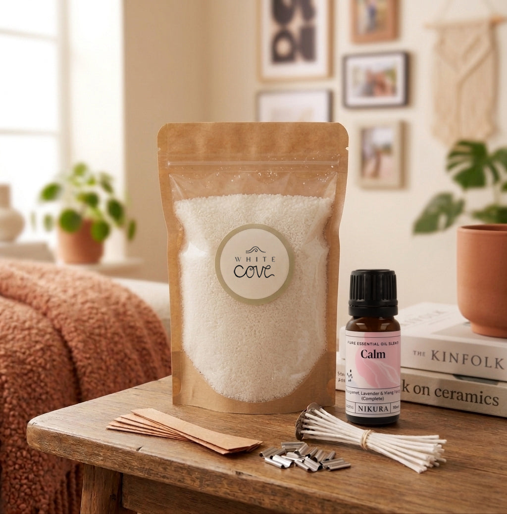 The Slow Down sustainable candle making kit by White Cove UK styled in a cozy living room. This lifestyle shot showcases the complete refillable candle ecosystem, including dual wick options and Calm fragrance oil, beautifully arranged alongside home decor to promote a relaxing, mindful aesthetic